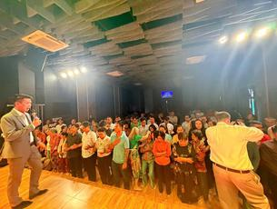 Bill Marshall ministering in an overseas church service